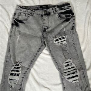 Amiri MX1 Grey & Black Jeans with Black Bandana Patches.